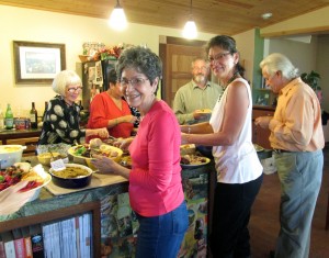 Delma (foreground, left) and her daughter Linda (right) at their Thanksgiving buffet.