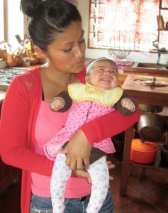 Young Mexican mother with her baby, Isabella