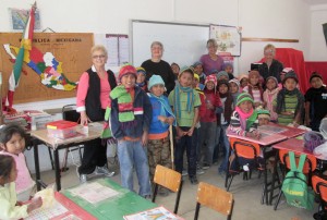 BEAUTY: darling campo kids in their classroom modeling the handmade hats and scarves we brought to them this week