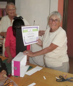 Artist-instructor Bobbie Norris receiving an award