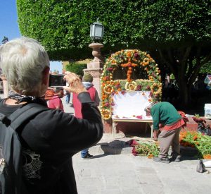 Marty photographing an altar being set up in the Jardin